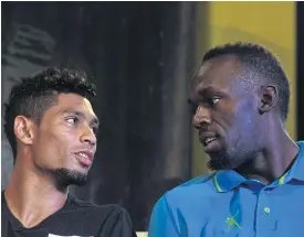  ??  ?? Wayde van Niekerk, left, chats with Usain Bolt during a press conference.