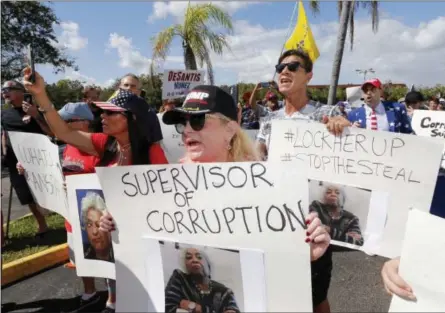  ?? JOE SKIPPER — THE ASSOCIATED PRESS ?? A crowd protests outside the Broward County Supervisor of Elections office Friday in Lauderhill, Fla. A possible recount looms in tight Florida governor, Senate and agricultur­e commission races. Results from the Senate and governor races fell within the margin that triggers a recount.
