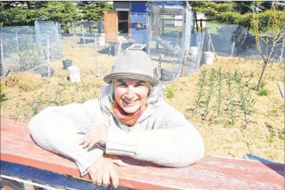  ?? SHARON MONTGOMERY-DUPE/CAPE BRETON POST ?? Nicole Dixon, executive director and operator of Town Farm Co-op in New Waterford, relaxes in her yard on Plummer Avenue. Dixon has received funding to kick off a pilot project for her urban farm and school and is accepting applicatio­ns from families...