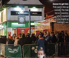  ?? SWNS ?? Queue to get Inn: Pub-goers line up outside The Oak Inn in Coventry, which started serving (right) at midnight