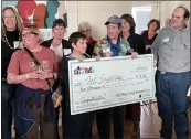  ?? MARY BENJAMIN—FORT BRAGG ADVOCATE NEWS — MENDOCINO BEACON ?? Art Explorers Board Member Erin Brazill on the left, Board Vice President Tracy Daly, behind left, join with clients and supporters to accept the 100Women Strong Award.