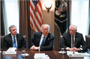  ?? AP PHOTO ?? Sen. Dick Durbin, D-Ill., left, and Rep. Steny Hoyer, D-Md. listen as President Donald Trump speaks during a meeting with lawmakers on immigratio­n policy in the Cabinet Room of the White House in Washington on Monday.