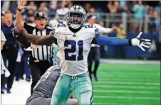  ?? [RON JENKINS/THE ASSOCIATED PRESS] ?? Cowboys running back Ezekiel Elliott celebrates after catching a pass in the second half against the Lions on Sunday in Arlington, Texas.