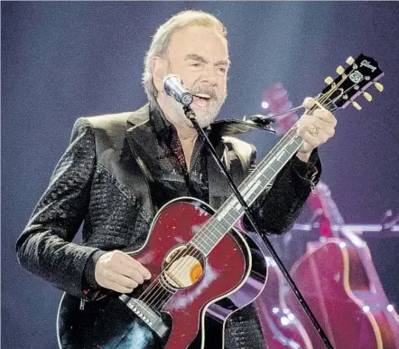  ?? Michael Owen Baker For The Times ?? NEIL DIAMOND dials down the glitz in a performanc­e at the Forum in Inglewood on Saturday that celebrated his 50 years in the biz.