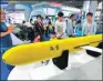  ?? ZHENG SHUAI / FOR CHINA DAILY ?? A model of is displayed at a cross-Straits trade fair in June.