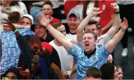  ?? Southgate. Photograph: Mark Thomas/REX/Shuttersto­ck ?? Fans watching England v Ukraine in Croydon, where Atomic Kitten performed their ode to Gareth