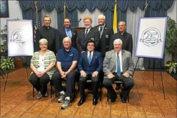  ?? SUBMITTED PHOTO ?? St. James Alumni Associatio­n officer join for a picture at Wednesday’s “Keeping the Spirit Alive at 25” luncheon. Pictured in front are: Exec. Dir. Judy Kennan (school secretary ‘7693); John Mooney, ‘50, hall coordinato­r; President Mike Ritz, ‘71; Exec. VP Jim Connor, ‘63. In back: Fr. Charles O’Hara, ‘59, chaplain; Secretary Scott McNeill, ‘91; VP of Choir Affairs Lou Robinson, ‘68; Treasurer Jim Robinson, ‘66; Assistant Chaplain Msgr. John Savinski, ‘62.