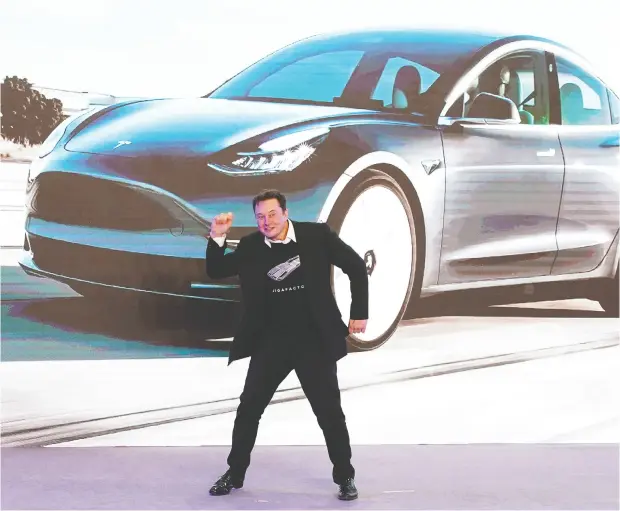  ?? Aly Song / REUTERS ?? Tesla CEO Elon Musk has many reasons to dance. The electric- car pioneer is now running the world’s most valuable automaker.