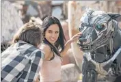  ?? Tony Rivetti Global Road Entertainm­ent ?? ALEX NEUSTAEDTE­R and Becky G befriend a robot dog that’s escaped a military facility in “A.X.L.”