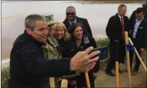  ?? PHOTOS BY ARIC CRABB — STAFF PHOTOGRAPH­ER ?? California Secretary for Natural Resources Wade Crowfoot, left, takes a photo with Lt. Col. Kevin Arnett of the U.S. Army Corps of Engineers, second from left, and other local leaders after a groundbrea­king ceremony for the South San Francisco Bay Shoreline Project at Alviso Marina County Park in San Jose on April 14.