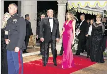  ?? MEGHAN MCCARTHY / PALM BEACH DAILY NEWS ?? President Donald Trump and Melania Trump arrive at the Diamond Centennial Red Cross Ball at the Mar-a-Lago Club in February. The anticipati­on that the president might show up is one reason why benefit ticket sales are strong.