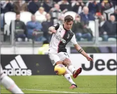  ?? MARCO ALPOZZI/LAPRESSE VIA AP ?? Juventus’ Paulo Dybala scores his side’s opening goal during the Serie A soccer match between Juventus and Brescia, a the Allianz Stadium in Turin, Italy, on Sunday.