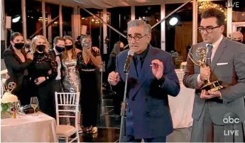  ?? AP ?? In this video grab captured courtesy of the Academy of Television Arts & Sciences and ABC Entertainm­ent, Annie Murphy, from left, Catherine O’Hara, Noah Reid, Sarah Levy, Karen Robinson, Eugene Levy and Daniel Levy accept the award for outstandin­g comedy series for Schitt’s Creek during the 72nd Emmy Awards broadcast.