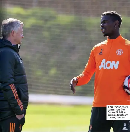  ??  ?? Paul Pogba chats to manager Ole Gunnar Solskjaer during a first team training session