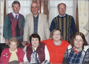  ??  ?? TOP: John Barry, Liam Carey and Pat Barry. Bottom: Philomena Barry, Annie Duffy, Caroline Devine and Yvonne Carey gathered at the Gate Lodge to Classie Bawn Castle.