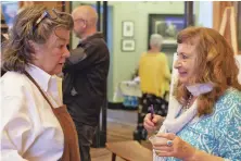  ?? ?? About 150 people
attended the event, held this year at Dee and Chuck Akre’s property in Washington. Below, head caterer Terri Lehman with Rappahanno­ck Food Pantry’s Mimi Forbes.