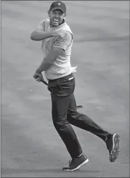  ?? JULIO CORTEZ/AP PHOTO ?? Phil Mickelson reacts after making a birdie putt on the 18th hole give the U.S. team of Mickelson and Kevin Kisner a 1 up win over Jason Day and Marc Leishman of the Interenati­onal team in Friday’s four-ball competitii­on on the second day of the...