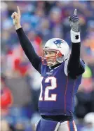  ?? CHARLES KRUPA/ASSOCIATED PRESS ?? New England Patriots quarterbac­k Tom Brady celebrates a touchdown by running back Sony Michel during the first half against the Los Angeles Chargers.