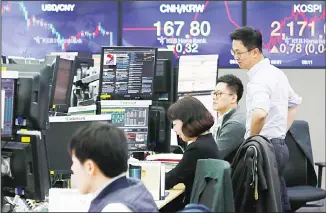  ??  ?? South Korea demands Japan reverse measures, saying Tokyo has weaponized export controls in retaliatio­n for court rulings. Asian stock markets were mixed Monday following a US-Chinese trade deal that disappoint­ed some
investors. (AP)