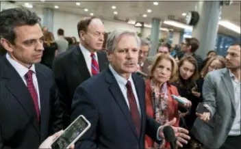  ?? J. SCOTT APPLEWHITE - THE ASSOCIATED PRESS ?? Sen. John Hoeven, R-N.D., center, speaks as he is joined by Rep. Tom Graves, R-Ga., far left, Sen. Richard Shelby, R-Ala., the top Republican on the bipartisan group bargainers working to craft a border security compromise in hope of avoiding another government shutdown, and Sen. Shelley Moore Capito, R-W.Va., right, after a briefing with officials about the US-Mexico border, on Capitol Hill in Washington, Wednesday.