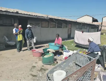  ?? Picture: Mkhuseli Sizani ?? ENCOURAGIN­G. About 27 families who have been living in classes at an abandoned school in New Brighton will soon be relocated to permanent homes.