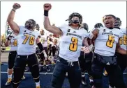  ?? / Kennesaw State - Kyle Hess ?? Kennesaw State quarterbac­k Chandler Burks (3), who rushed for another three touchdowns to give him 26 on the season, celebrates with lineman Devin Pughsley (79) and backup quarterbac­k Tommy Bryant.