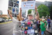  ?? JESSICA HILL/ASSOCIATED PRESS ?? Lynn Wencus of Wrentham, Mass., displays signs with a picture of her late son Jeff and others lost to OxyContin and other opioids at a protest in Stamford, Conn., Aug 17.