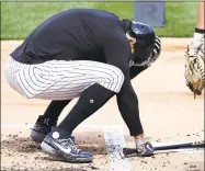  ?? Elsa / Getty Images ?? Giancarlo Stanton of the New York Yankees reacts after his at-bat hit Masahiro Tanaka during summer workouts at Yankee Stadium on Saturday in New York.