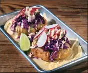  ?? SHERRY LAVARS — MARIN INDEPENDEN­T JOURNAL ?? Hook Fish's Fried Avocado Tacos come with pickled slaw, pico de gallo and spicy aioli.