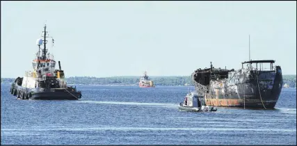  ?? KATHY Johnson/tricounty vanguard ?? The Farley Mowat is towed out of Shelburne Harbour on July 26, 2017, after being abandoned here by its owner in September 2014.