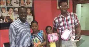  ??  ?? Managing Director of Dream Cosmetics, Uchenna Harris Okonkwo; presenting Dream Cosmetics Products to the children of SOS Orphanage Villages,Isolo branch, flanked by the Area Sales Manager of Dream Cosmetics, Babatunde Ojumola; in Lagos...recently