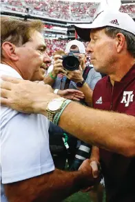  ?? The Associated Press ?? ■ Alabama head coach Nick Saban shakes hands with Texas A&M head coach Jimbo Fisher after a game on Sept. 22, 2018, in Tuscaloosa, Ala. Fisher called Saban a “narcissist” Thursday after the Alabama coach made “despicable” comments about the Aggies using name, image and likeness deals to land their top-ranked re- cruiting classes. Saban called out Texas A&M on Wednesday night for “buying” players.