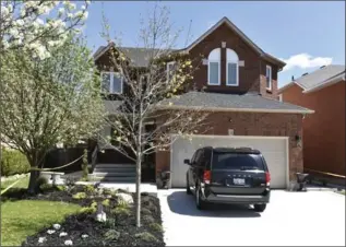  ?? JOHN RENNISON, THE HAMILTON SPECTATOR ?? Police tape still surrounds the home of Angelo Musitano at 14 Chesapeake Dr. in Waterdown Wednesday. He was fatally shot in his car in his driveway Tuesday afternoon in a killing that has the hallmarks of a mob hit.