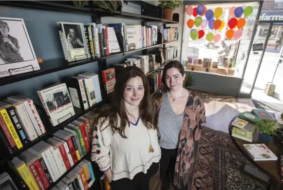  ?? BERNARD WEIL PHOTOS/TORONTO STAR ?? Alex Snider and Liz Burns are the owners of a new bookstore called Queen Books. The two saw a gap in Leslievill­e and decided to fill the “black hole,” as Burns calls it.