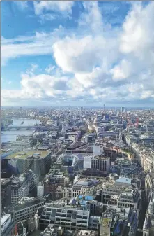  ?? ?? The panorama shows the River Thames snaking westward to Westminste­r and the Houses of Parliament.