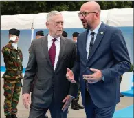  ?? AP/BENOIT DOPPAGNE ?? Defense Secretary James Mattis (left) talks with Belgian Prime Minister Charles Michel as they arrive Wednesday for an event in Brussels. The U.S. is pressuring NATO allies to spend more on defense.