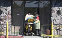  ?? DOUG DURAN STAFF PHOTOGRAPH­ER ?? A person is taken into the Gateway Care and Rehabilita­tion Center in Hayward on April 10. Records show Gateway had serious problems well before the pandemic.