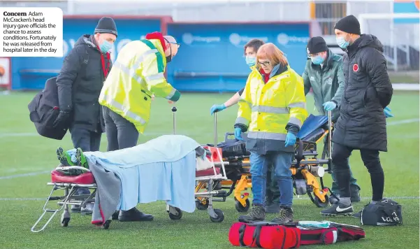  ??  ?? Concern Adam Mccracken’s head injury gave officials the chance to assess conditions. Fortunatel­y he was released from hospital later in the day