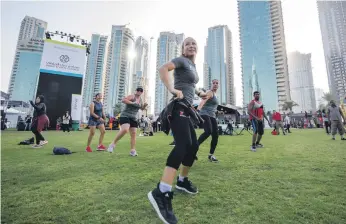  ?? Leslie Pableo for The National ?? A fitness session as part of the Dubai Fitness Challenge at Burj Park