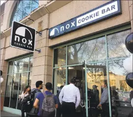  ?? PHOTO BY SAL PIZARRO ?? Customers line up for the grand opening of Nox Cookie Bar in downtown San Jose.