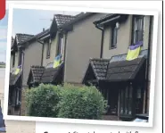  ?? ?? Support Street decorated with flags