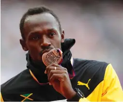 ?? (Reuters) ?? USAIN BOLT finished third in his last solo race at the World Athletics Championsh­ips men’s 100m final where American Justin Gatlin took the gold.