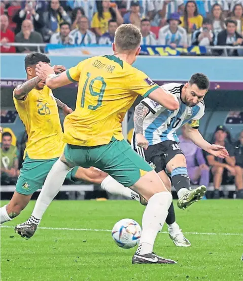  ?? ?? Lionel Messi opens the scoring for Argentina with a typically precise finish