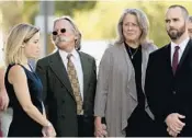  ?? RANDY VAZQUEZ/STAFF PHOTOGRAPH­ER ?? Seth Adams’ parents Lydia and Richard, center, are seeking damages from the Palm Beach County Sheriff’s Office and a sheriff ’s sergeant who shot and killed their son.