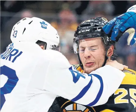  ?? MADDIE MEYER GETTY IMAGES ?? The Leafs’ Nazem Kadri tussles with Boston’s Brandon Carlo during the Bruins’ 6-3 win on Dec. 8 at TD Garden. The Leafs close out their season series vs. Boston on Saturday at Scotiabank Arena.