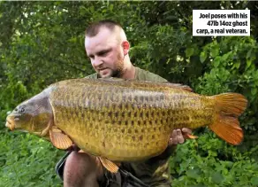  ??  ?? Joel poses with his 47lb 14oz ghost carp, a real veteran.