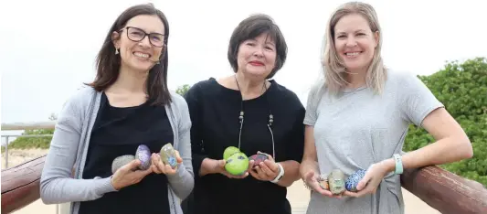  ?? Pictures: MADELEINE CHAPUT ?? BUILDING LEGACIES: Bernadette Meaker, centre, and her daughters, Ingrid Meaker-Dewing, left, and Faye Meaker-Saunders, right, have started the East London Rocks community art project in an attempt to add a little colour and inspire people in the city.