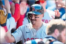  ?? ALEX GALLARDO/AP PHOTO ?? Reese McGuire of the Boston Red Sox reacts in the dugout after hitting a three-run home run against the Los Angeles Angels during the sixth inning of Sunday’s game in Anaheim, Calif.