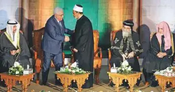  ?? Reuters ?? Shaikh Ahmad Al Tayyeb greets Abbas at the Cairo conference as Pope Tawadros II, spiritual leader of Egypt’s Orthodox Christians, Saleh Bin Abdul Aziz Al Shaikh, Saudi Minister of Islamic Affairs and Marzouq Al Ganem, Kuwait’s parliament speaker...