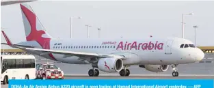  ?? — AFP ?? DOHA: An Air Arabia Airbus A320 aircraft is seen taxiing at Hamad Internatio­nal Airport yesterday.